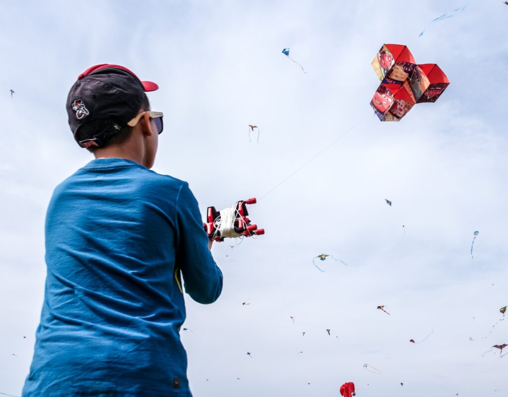 kid flying kite